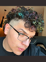Person with colorful curly hair.