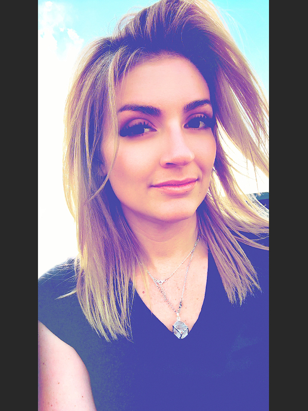 Person with long, styled hair.