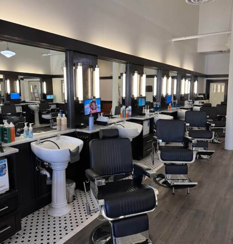 Modern barber shop interior with stations.