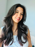 Long, wavy hair, casual outfit.