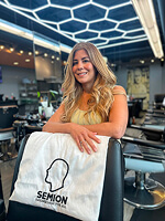 Woman in salon with stylish hair