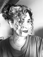 Person with curly hair in grayscale