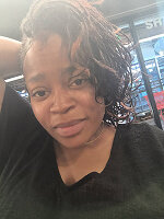 Person with curly hair in salon