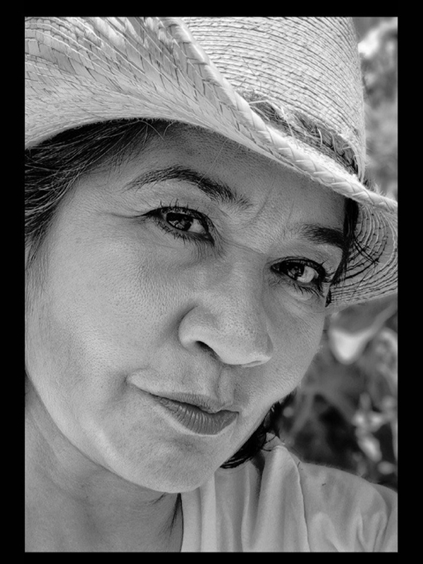 Person wearing a straw hat.