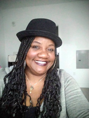 Person wearing a black hat.