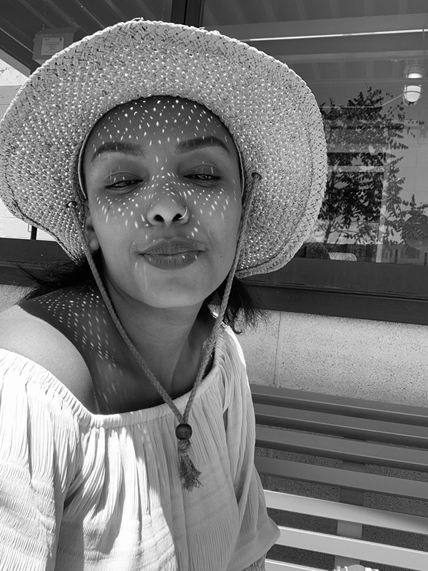 Person wearing a wide-brimmed hat