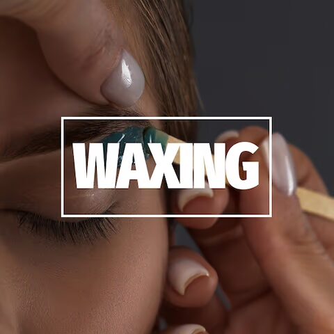 Eyebrow waxing procedure in progress.